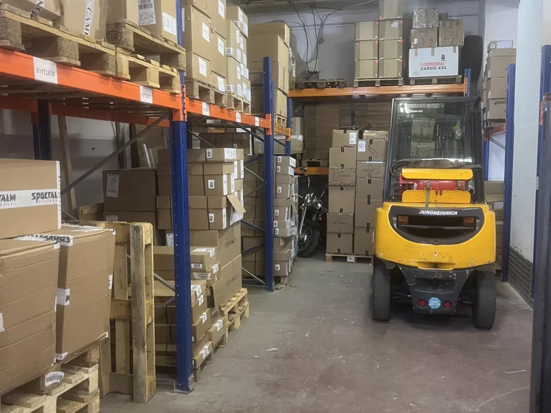 Forklift between pallet racks in the ZWOD warehouse in Berlin